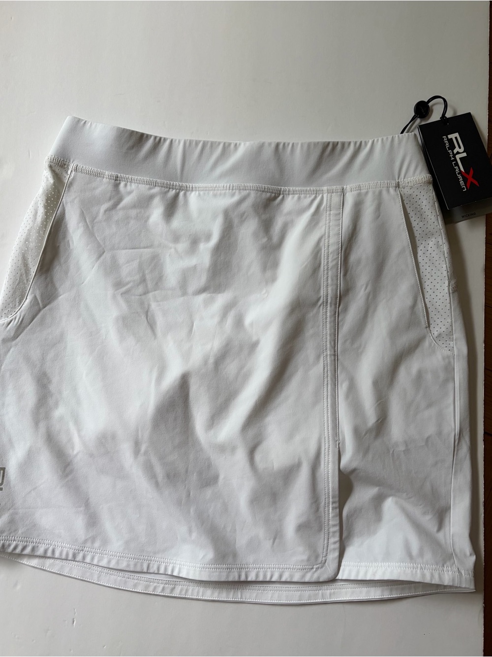 NWT RLX Ralph Lauren Women's XS Athletic Skort. Moisture Wicking. Pockets. Golf